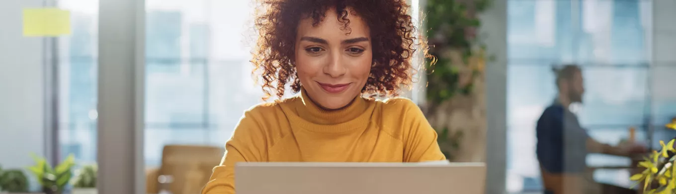 Happy woman on laptop