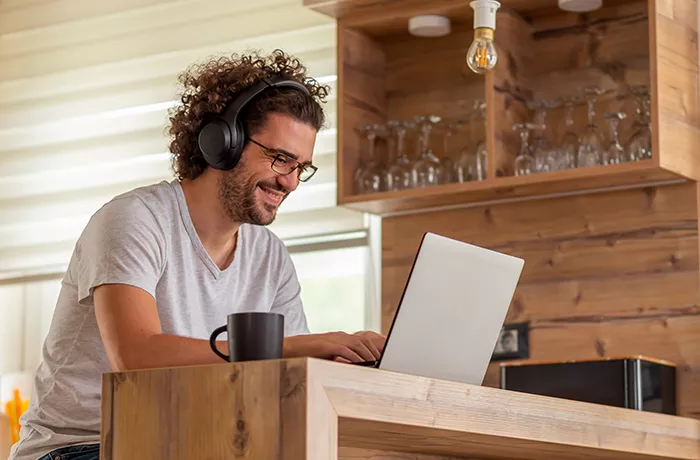 Happy man at computer