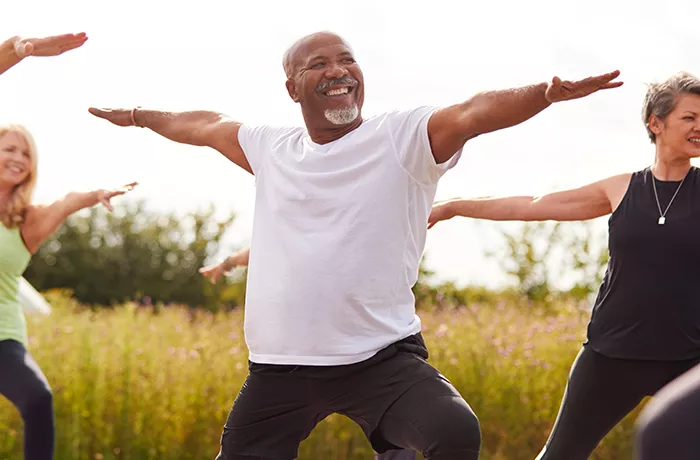 Man doing stretches in a field