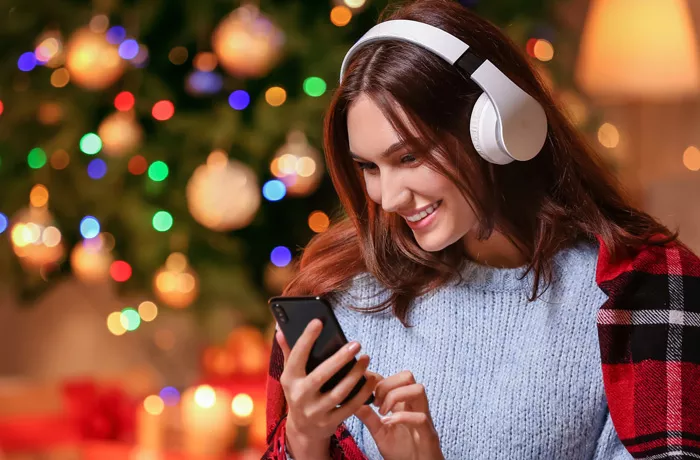 girl holding a phone and listening to music