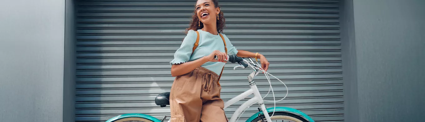 woman leaning against a bike