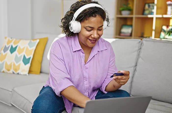 woman shopping online with a card