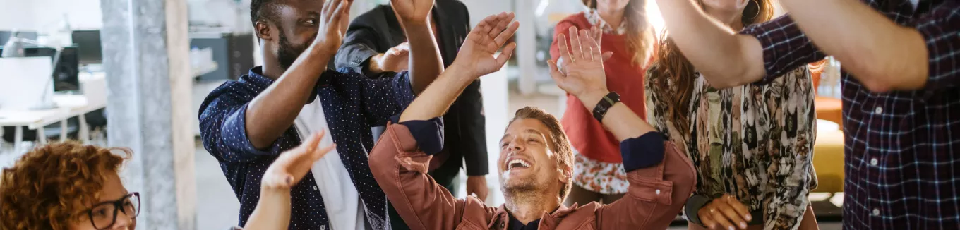 team celebrating at work