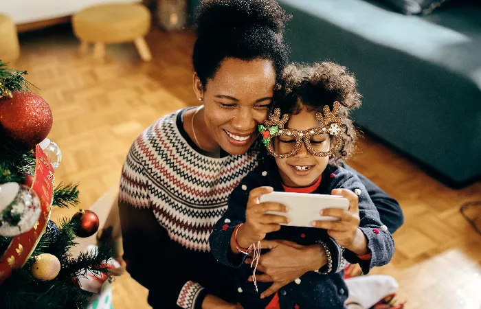 mum and daughter by their Christmas tree