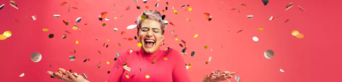 woman celebrating with glitter confetti