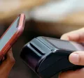 Person contactless paying using their phone